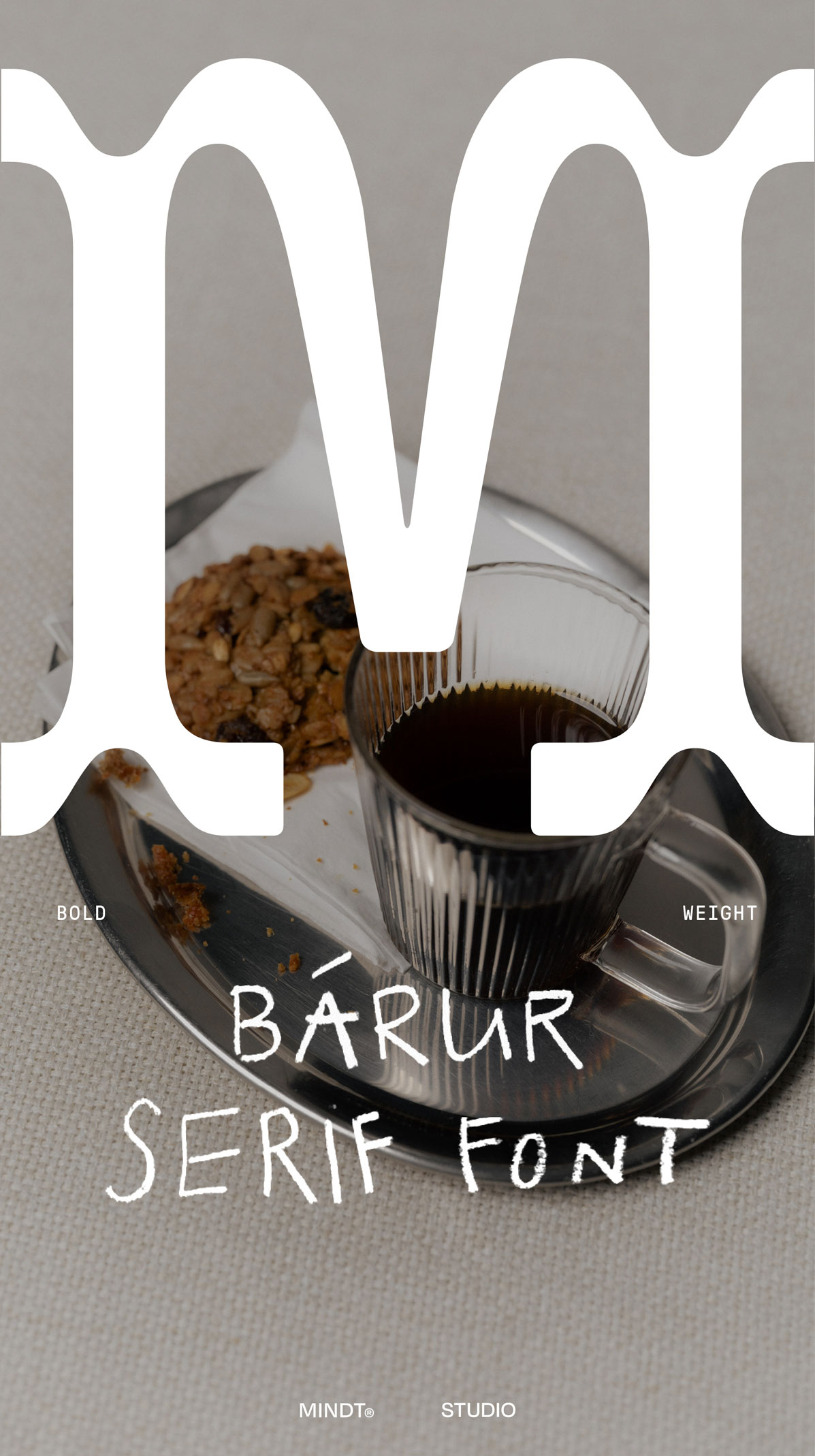 Bárur Bold typography featured in a warm lifestyle scene with a coffee cup and biscuit on a tray.